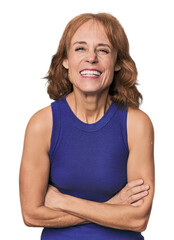 Redhead mid-aged Caucasian woman in studio laughing and having fun.