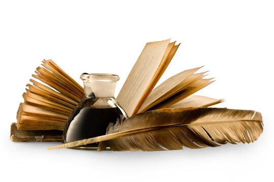 An old book with a feather and the inkpot full of ink