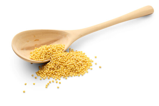 Millet groats with wooden spoon