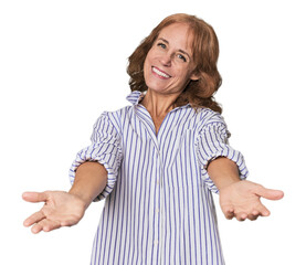 Redhead mid-aged Caucasian woman in studio showing a welcome expression.