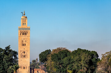 View of the minaret of Koutoubia Mosque and trees in Marrakesh, Morocco - 750700276
