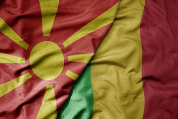 big waving national colorful flag of mali and national flag of macedonia .