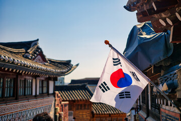 SEOUL, SOUTH KOREA - MARCH 01, 2024 : Unidentified tourists are traveling to traditional Korean style architecture at Bukchon Hanok Village in Seoul, South Korea.