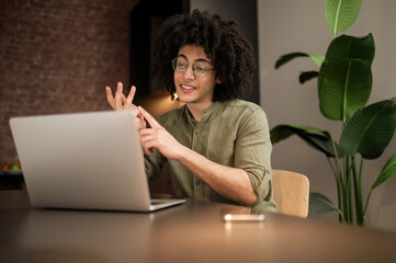Young businessman having a video call and looking involved