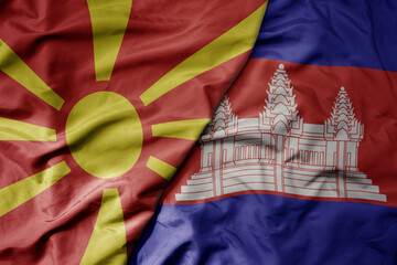 big waving national colorful flag of cambodia and national flag of macedonia .