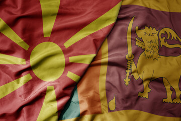 big waving national colorful flag of sri lanka and national flag of macedonia .