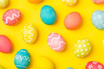 Easter eggs on a bright background. Easter celebration concept. Colorful easter handmade decorated Easter eggs. Place for text. Copy space.