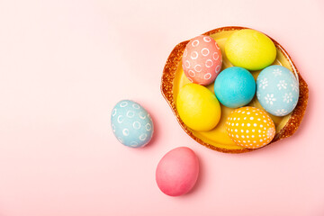 Easter eggs on a bright background. Easter celebration concept. Colorful easter handmade decorated Easter eggs. Place for text. Copy space.