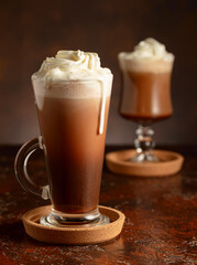 Creamy milk chocolate drinks with whipped cream.