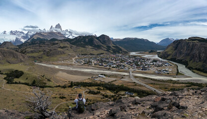 Hiker Overlooking a Scenic Mountain Town in Patagonia