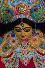 Decorated idol of Hindu Goddess Durga with use of selective focus . Close up.