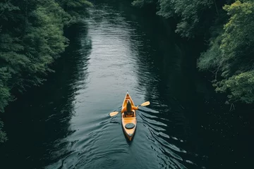 Foto op Plexiglas A person effortlessly canoeing down a serene river © PixelPioneerX