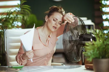 Poster modern woman employee at work suffering from summer heat © Alliance