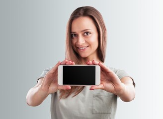 Human hand holding blank screen smart phone