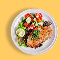 Grilled chicken with vegetables top view isolated