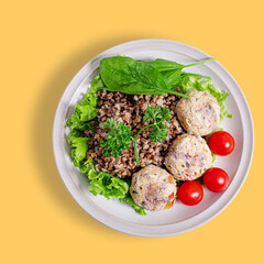 Buckwheat and meatballs plate top view