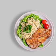 Grilled chicken with bulgur top view isolated
