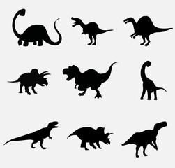 Set silhouettes of dinosaurs. Vector illustration group of black dinosaur silhouette icons isolated on white. Logo side view