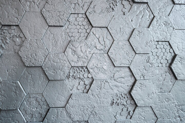 Background made of grey hexagonal gypsum tiles, textured, mosaic.