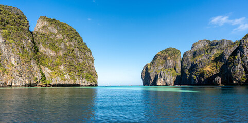 Famous Maya Bay beach at Ko Phi Phi Leh Island morning light , crystal clear water, steep limestone hills in background. Main Thailand tourist attraction, Krabi, Andaman Sea in 2024 post-COVID