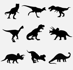 Set silhouettes of dinosaurs. Vector illustration group of black dinosaur silhouette icons isolated on white. Logo side view © tabon