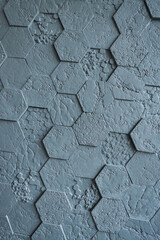 Background made of grey hexagonal gypsum tiles, textured, mosaic.