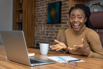 Woman using laptop coordinates conferences providing platform for remote communication
