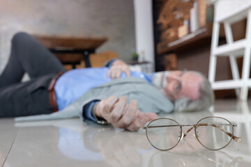 Senior man lying unconcious suffer from heart attack in his room