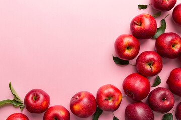 Many red apples on colored background, top view. Autumn pattern with fresh apple above view with copy space for design or text
