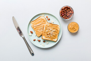 Peanut butter sandwiches or toasts on light table background.Breakfast. Vegetarian food. American cuisine top view vith copy space