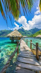 Turquoise ocean with wooden walkway leading to overwater bungalows at tropical resort