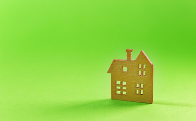 Model of the wooden house on green background. concept of sell of house, architecture. copyspace