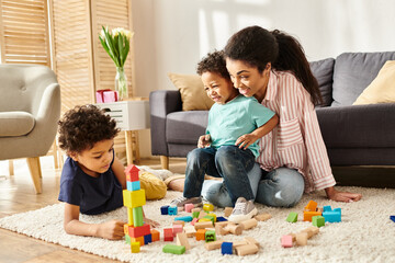 merry attractive african american mother playing with toys with her little adorable sons at home