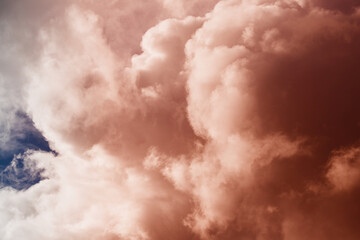 Cumulus clouds in unusual light in the sky, fantastic sky landscapes, unusual color of clouds in...