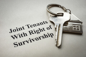 Key lie on paper with a mark Joint tenants with right of survivorship.