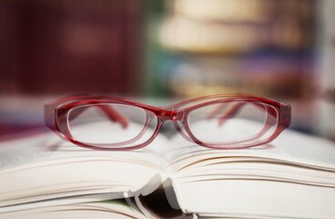 Diplopia concept Diagnosis in Ophthalmology. Glasses and book