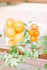 styled oranges in glass containers