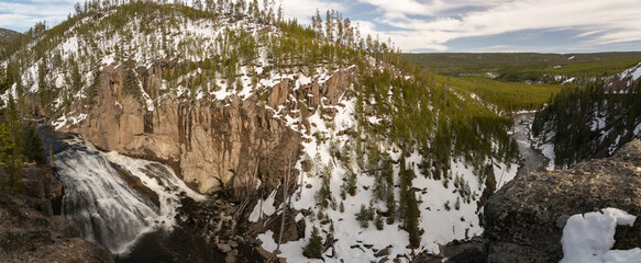 Panoramic view of a snowy waterfall in Yellowstone