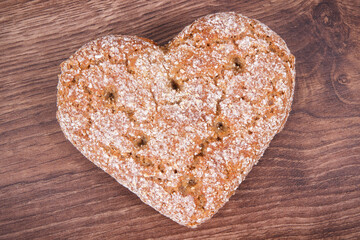 Fresh wholegrain bread in shape of heart for breakfast