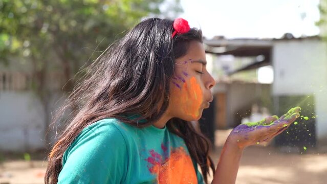 Kids playing with color at home During holi Festival of Colors