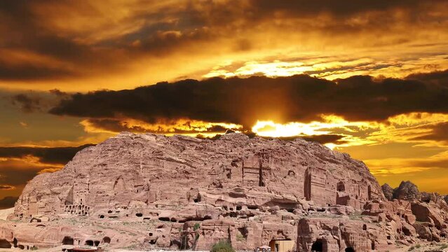 Mountains of Petra (against the background of the sunset, 4K, time lapse, with zoom), Jordan, Middle East. Petra has been a UNESCO World Heritage Site since 1985