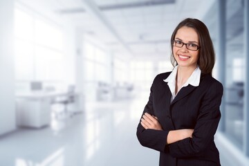 Happy confident professional business woman posing in office