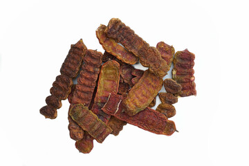 Dried pods of Acacia concinna on white background It is a black-brown pod with a rough, wrinkled surface and wavy edges. The parts used are the stem, leaves, flowers, fruits, roots, pods, and seeds. 