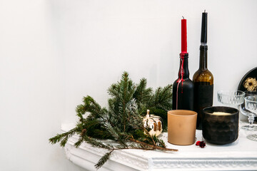 Festive Mantel Display with Candles and Pine Branch