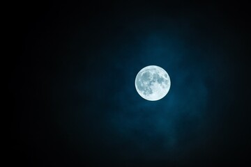 The brilliant white moon shines amidst the mystical night sky, casting an enchanting glow upon the...