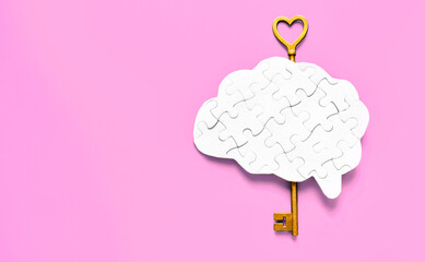 Unlocking the Mind: Brain Puzzle with Key on Pink