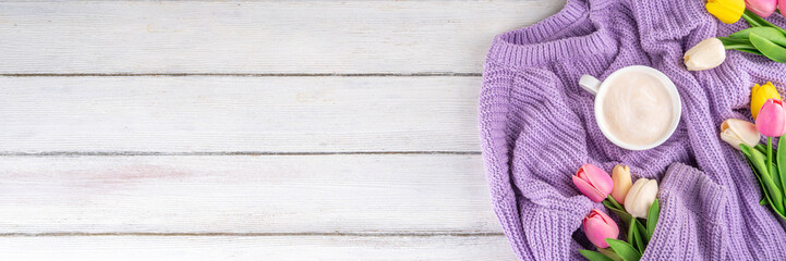 Spring morning with coffee background. A cup of coffee latte, lilac woman knitted sweater, a bouquet of tulips flowers. Spring holidays, holiday background, greeting card, top view flat lay copy space