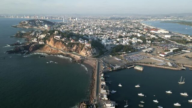 Drone fly above Mazatlan city in Mexico Sinaloa State revealing the port harbour