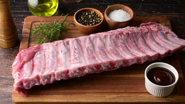 raw pork spare ribs on wooden board