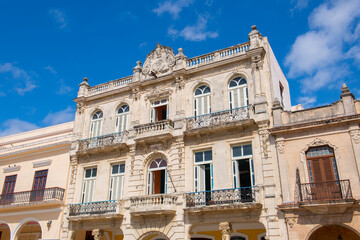 Historic buildings on Old Town Square (Plaza Vieja) in the morning in Old Havana (La Habana Vieja), Cuba. Old Havana is a World Heritage Site. 